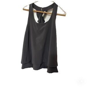 Boutique grey sleeveless racerback top with ruffle details